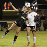 Midair Header Challenge During Night Soccer Match