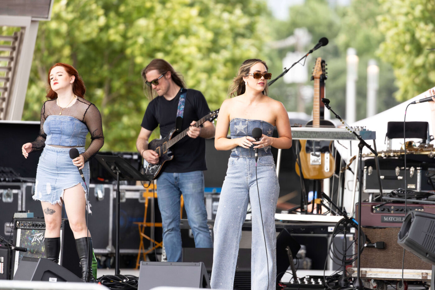 Lead vocalist of OK3 performs on stage at Scissortail Park during the Kickin' It On Route 66 Centennial Celebration in Oklahoma City.