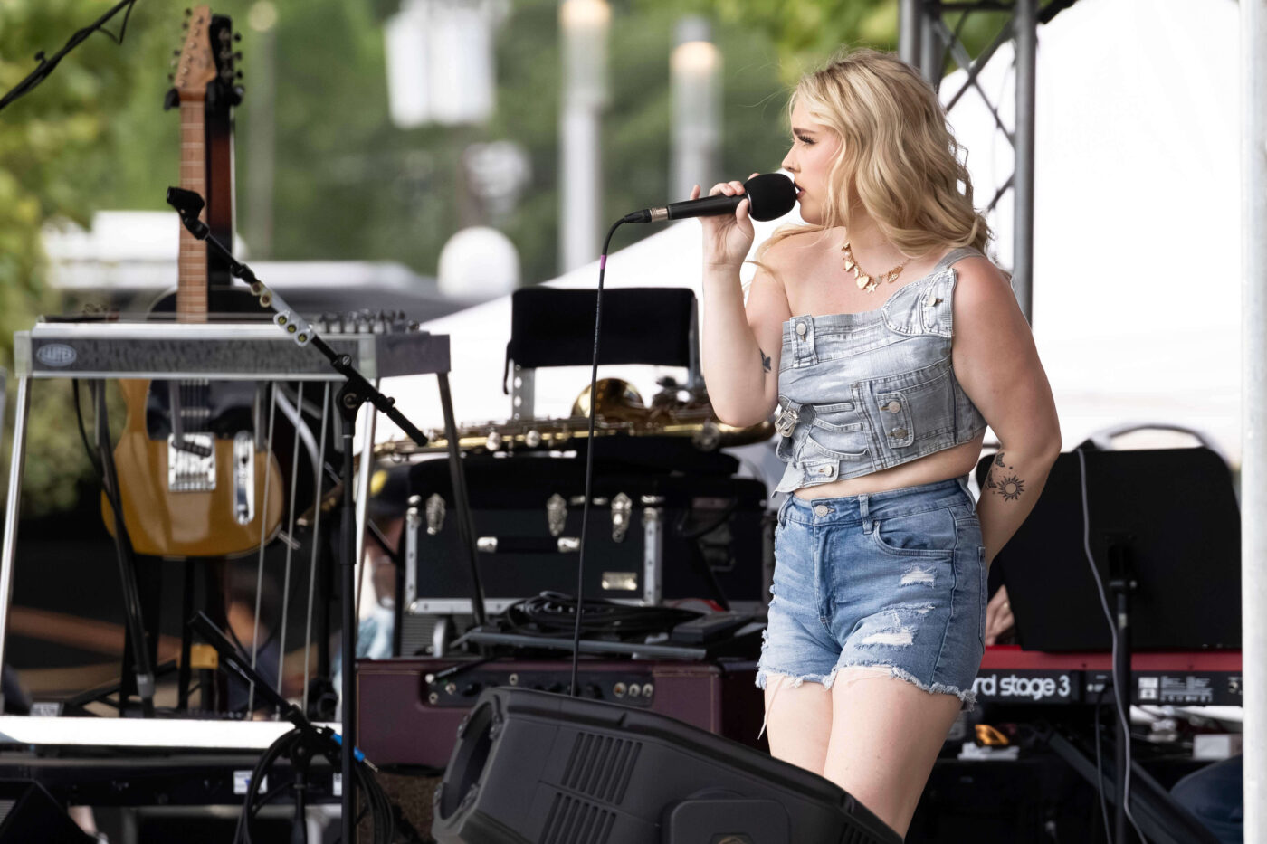 OK3 vocalists and guitarist perform on stage during the Route 66 Centennial Celebration in Oklahoma City.