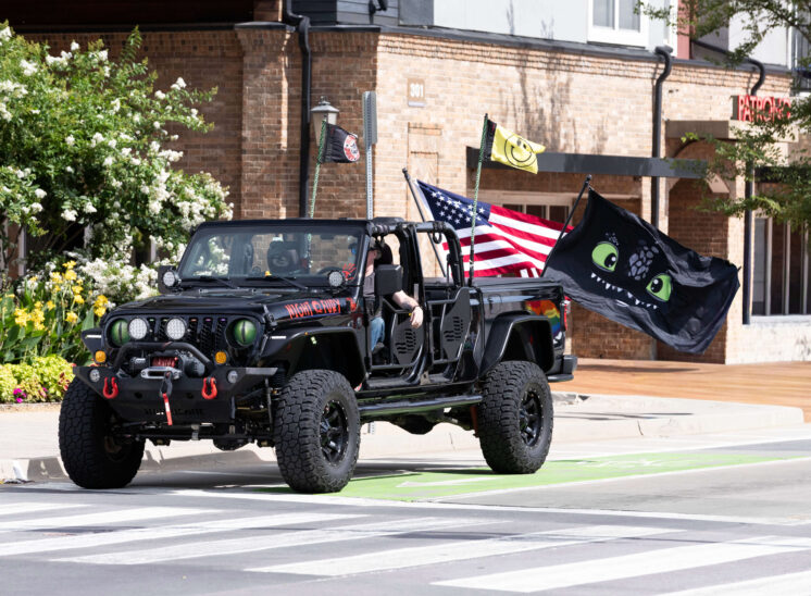 Decorated Jeep carrying flags participates in the Oklahoma City Pride Parade.