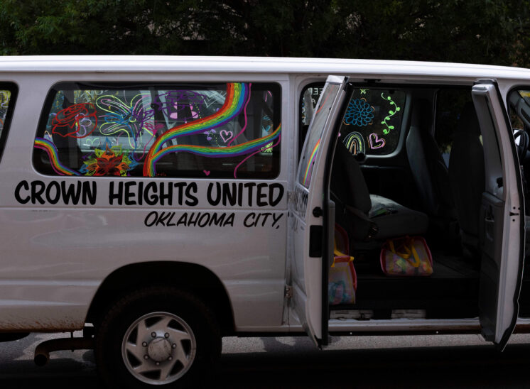 Decorated community van displaying colorful artwork during the Oklahoma City Pride Parade.