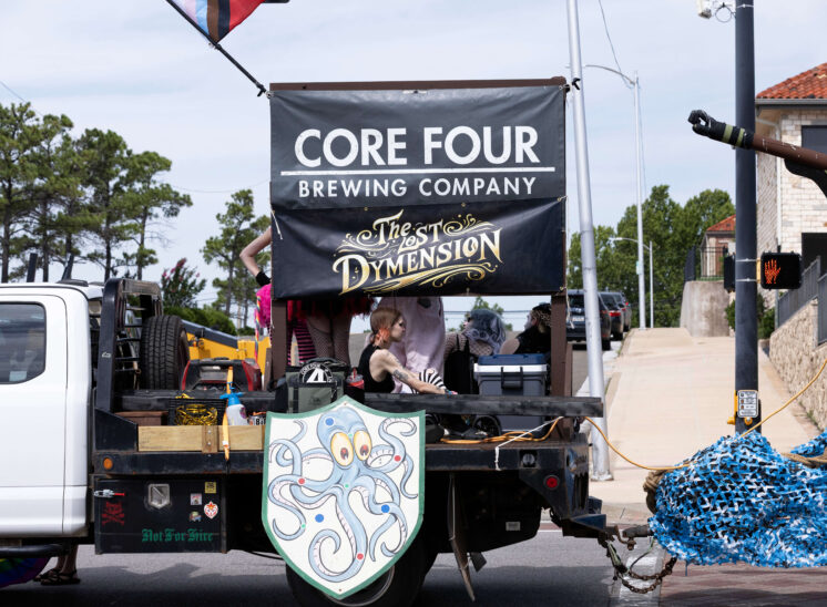 Brewery-sponsored float decorated with fantasy-themed artwork during the parade.