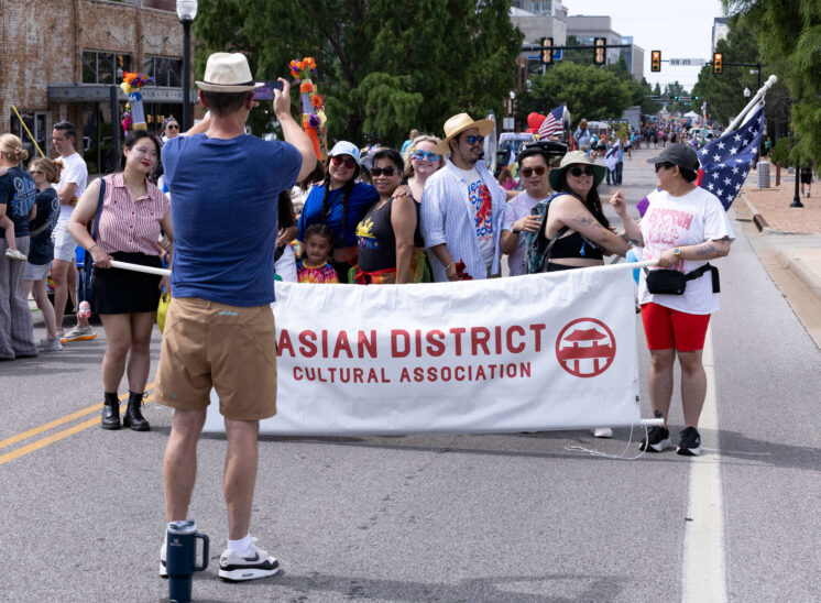 Members of the Asian District Cultural Association pose together during the Oklahoma City Pride Parade.
