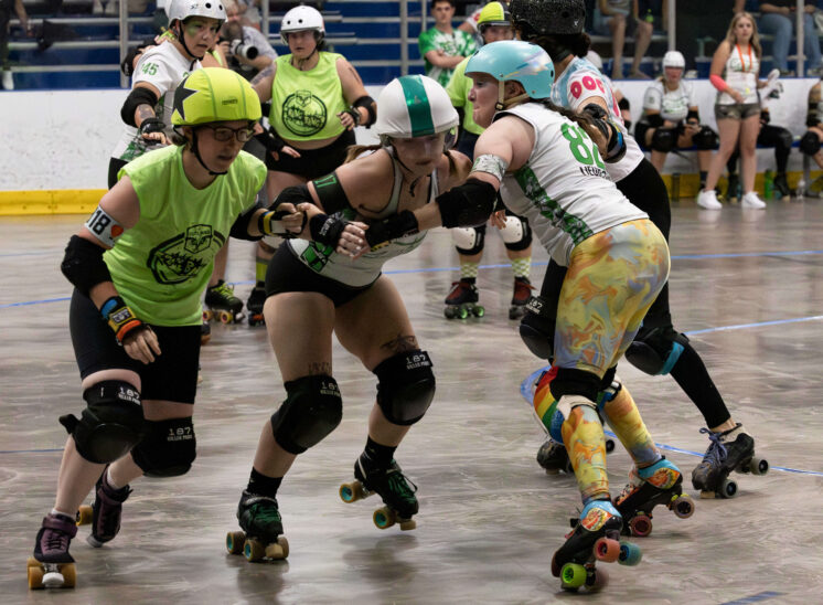 Twister City Roller Derby Outlaws skater skates alone on the track during a bout against the Capital City Crushers.