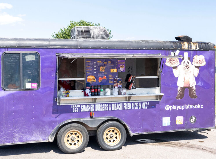 Purple Playa Plates food truck serving burgers and hibachi meals at Yukon Freedom Fest.
