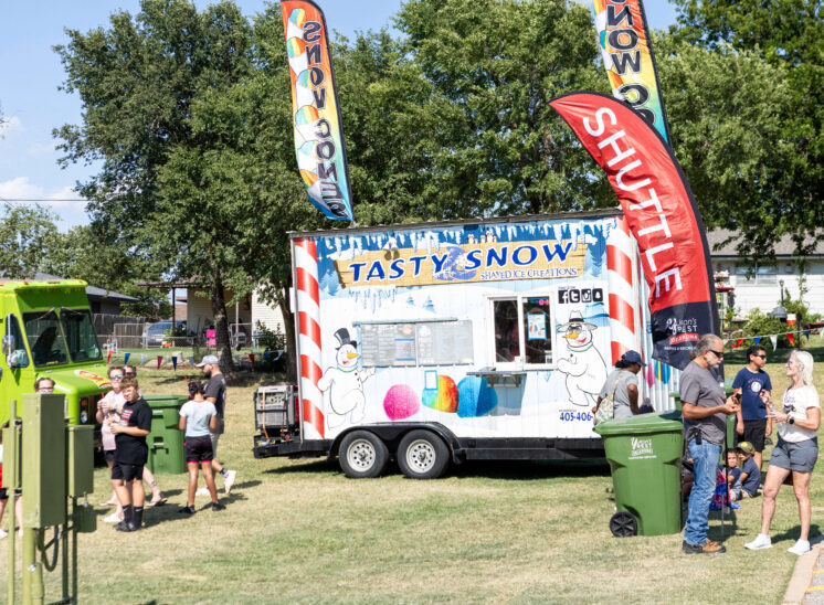 Tasty Snow shaved ice vendor serving customers during Yukon Freedom Fest.