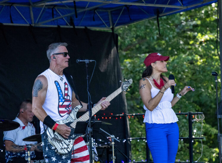 Female vocalist and bassist performing on stage during Yukon Freedom Fest.