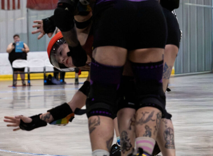 Twister City Roller Derby blocker SharpE Marker battles through a pack during the All Stars matchup against Memphis A.